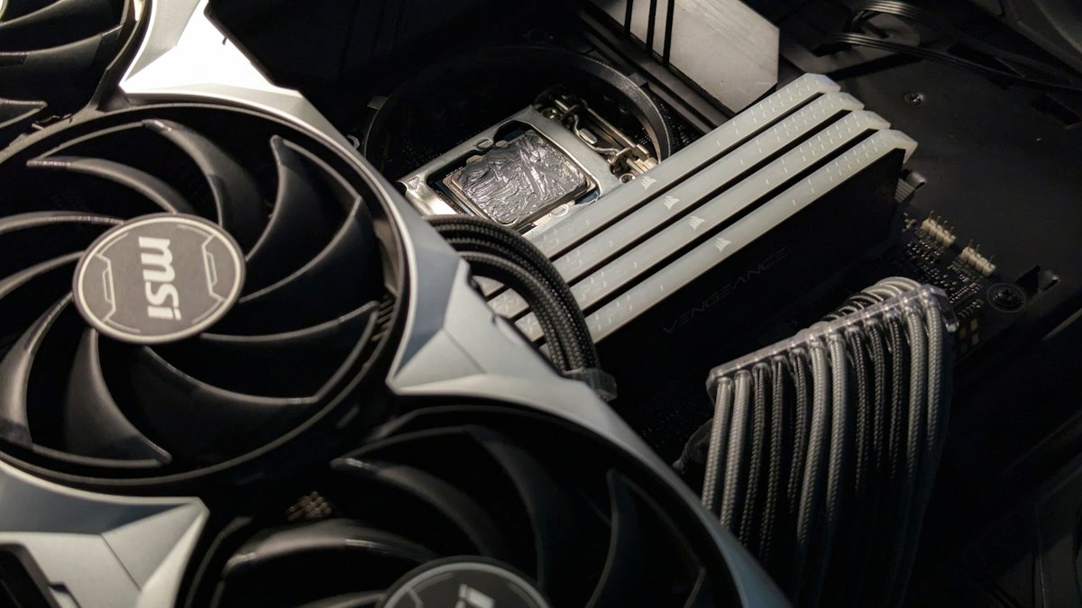 Inside a custom gaming PC: graphics card, CPU cooler and tidy cables